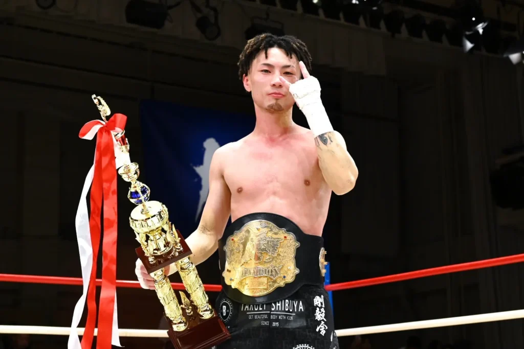 Krush Champion with belt
